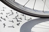 close-up of bicycle wheel and nail
