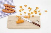 still life of carrots cutting board and knife