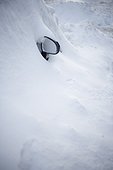 wing mirror of car covered in snow in winter