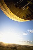 a hot air balloon lifting into the sky; kenya