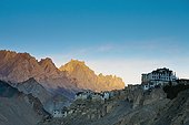 buildings on the edge of rock ledges beside the mountains; lamayuru ladakh india