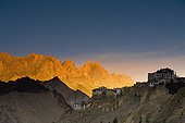 buildings on the edge of rock ledges beside the mountains; lamayuru ladakh india