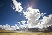 sunlight and cloud over a lake and mountains; ladakh jammu and kashmir india