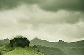 cloudy sky over a rugged landscape; new zealand