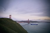 a ship and the golden gate bridge in san francisco bay; san francisco california united states of america