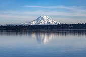 A reflective view of Mount Rainer from Dana Passage, South Puget Sound in Washington, approximately 60 miles distant; Washington, United States of America
