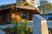 The Anchorage Visitors Center log cabin in downtown Anchorage, Southcentral Alaska, Summer
