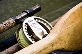 Digitally Altered, Close up of a Fly fishing reel, rod and oars laying in a skif, Southwest Alaska, Summer