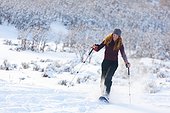 Woman snowshoeing at Park City, Utah, Winter
