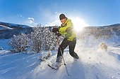 Man snowshoeing at Park City, Utah, Winter