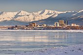 View of Anchorage skyline, Chugach Mountains and Cook Inlet from Earthquake Park, Southcentral Alaska, Winter