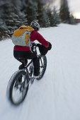 Woman riding a Fatback snow bike, Hillside trails, Anchorage, Southcentral Alaska, Winter