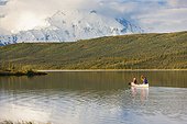 Mature couple canoeing in Wonder Lake, Denali National Park & Preserve, Interior Alaska, Summer