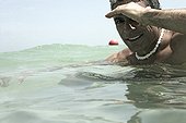 Portrait of a man bathing in the sea.