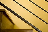 Detail of Modern Hardwood Stairwell and Yellow Wall