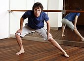 Young man stretching