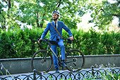 Bearded Businessman In Helmet And Suit With Bike.