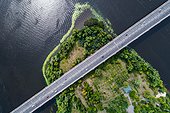 Aerial View Of The Bridge And The Road Over The Dnepr River Over A Green Island In The Middle Of The River