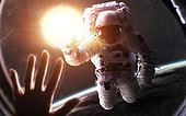 Astronaut In Front Of Glowing Sun. Space Science Fiction Visualization. Elements Of This Image Furnished By Nasa