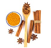 Close Up The Brown Cinnamon Stick And Powder With Star Anise Spice In Wooden Spoon Isolated On White Background
