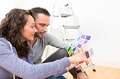 Young Couple Choosing Colors Of Their New Flat