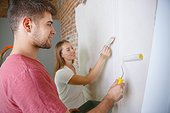 Young Couple Doing Apartment Repair Together Themselves