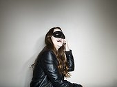 Studio shot of woman wearing mask
