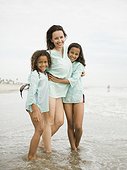 USA, California, Los Angeles, Portrait of mother with daughters (6-11) on beach