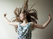 Studio shot of young woman dancing