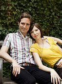 USA, New York, New York City, Portrait of young couple on park bench