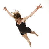 Woman falling against white background