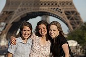 France, Paris, Portrait of three young women in front of Eiffel Tower