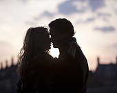 UK, London, Silhouette of couple kissing at sunset