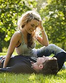 UK, London, Couple relaxing on grass