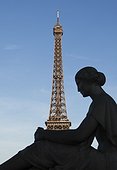 France, Paris, Statue of woman in front of Eiffel Tower