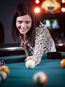 USA,Utah,American Fork,Young woman playing billiards,Smiling
