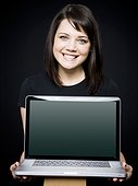 Young woman showing laptop