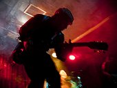 USA,Utah,Provo,Young man playing guitar in nightclub,blurred motion