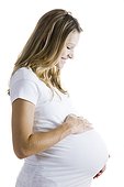 Studio shot of a pregnant young woman holding her belly