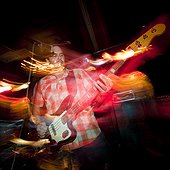 USA,Utah,Provo,Man playing electric guitar in club