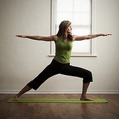 USA,Utah,Orem,Young woman performing yoga indoors