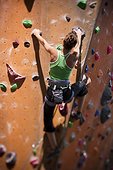 USA,Utah,Sandy,Female rockclimber on indoor climbing wall