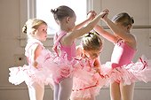 Four girls (2-3,4-5) practicing in ballet studio