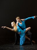 Young man and woman ballroom dancing