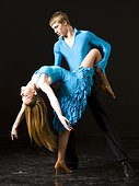 Young man and woman ballroom dancing