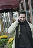 Mature man talking on a mobile phone and smiling