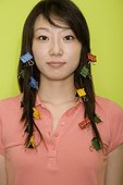 Portrait of a young woman with paper clips in her hair