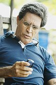 Close-up of a mature man using a mobile phone