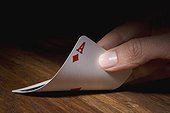 Close-up of a person's hand holding a card
