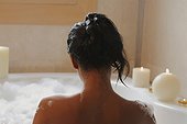 Close-up of a woman taking a bubble bath